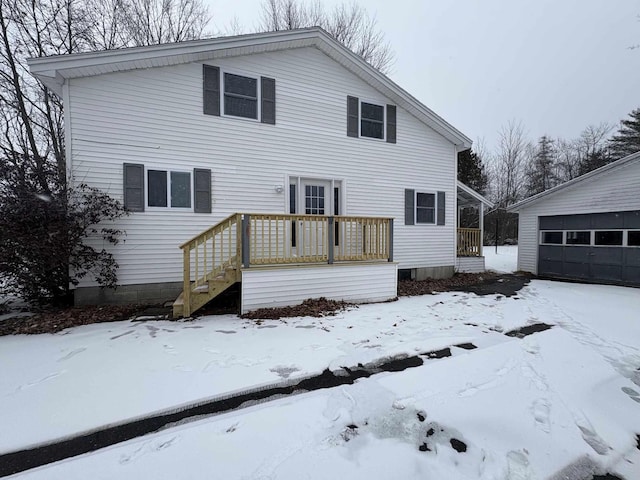 exterior space featuring a garage and an outdoor structure