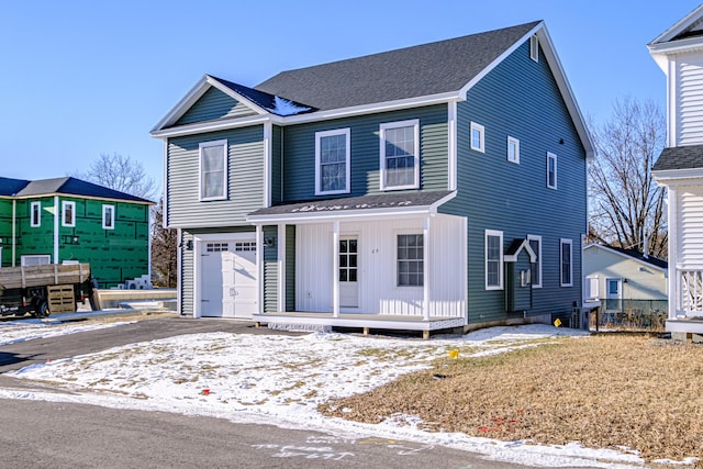 view of front property with a garage and covered porch