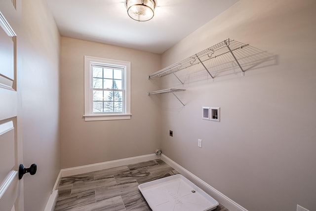 clothes washing area with washer hookup and hookup for an electric dryer