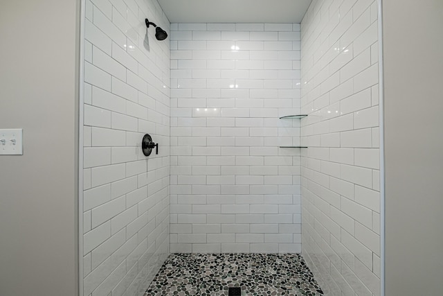 bathroom with tiled shower