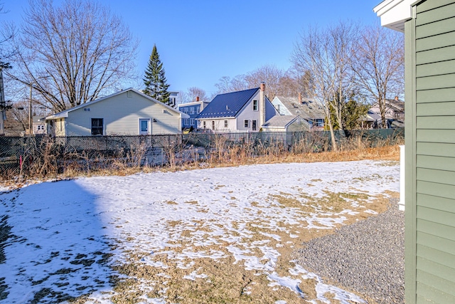 view of yard layered in snow