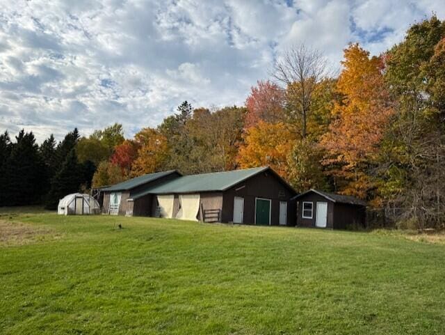 55 Brown Rd, Oakfield, ME 04763 - view of home's exterior featuring an outbuilding and a lawn