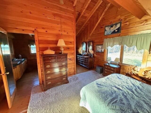 55 Brown Rd, Oakfield, ME 04763 - bedroom featuring dark hardwood / wood-style flooring, vaulted ceiling with beams, and wooden walls