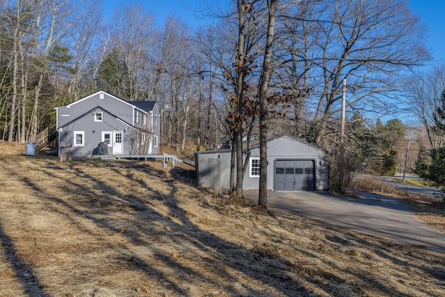 view of side of home with an outbuilding and a garage