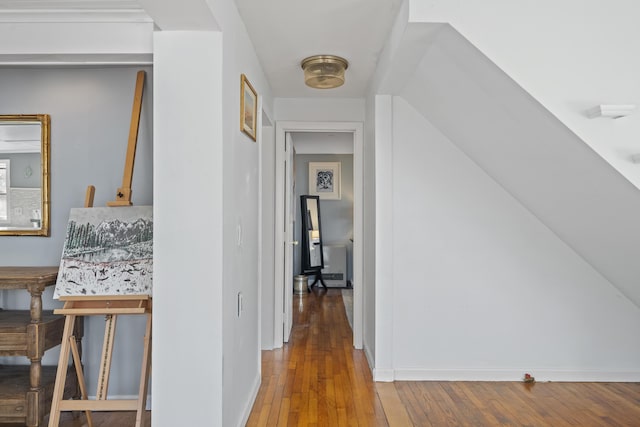 corridor featuring hardwood / wood-style floors