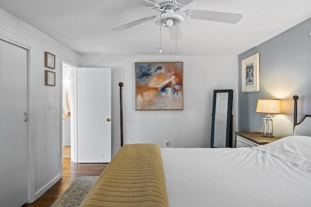 bedroom featuring ceiling fan and dark hardwood / wood-style floors