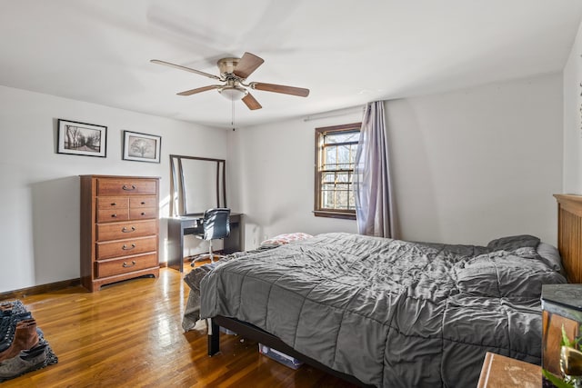 bedroom featuring wood-type flooring and ceiling fan