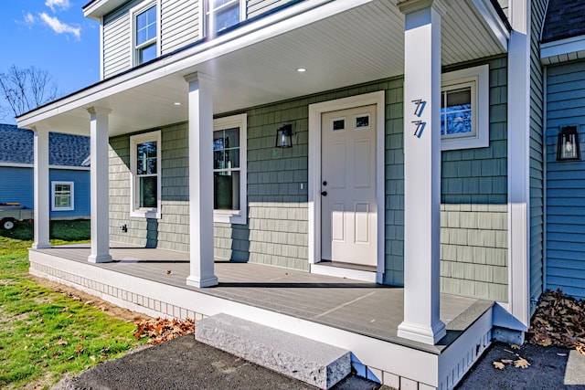 property entrance with covered porch