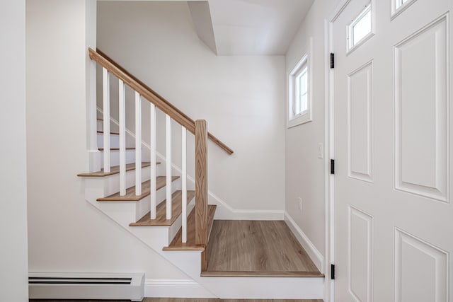 foyer featuring hardwood / wood-style floors and baseboard heating