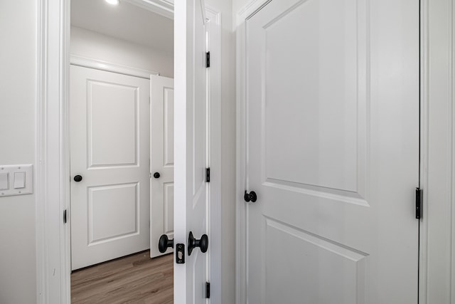 hall with light hardwood / wood-style floors