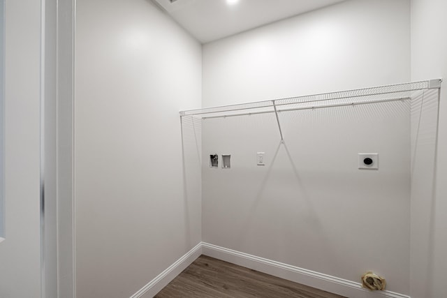 laundry area with hookup for a washing machine, hookup for an electric dryer, and dark hardwood / wood-style floors