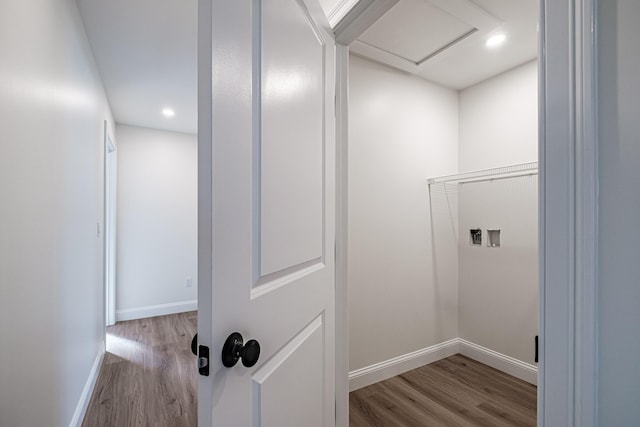 laundry room featuring light hardwood / wood-style flooring and hookup for a washing machine