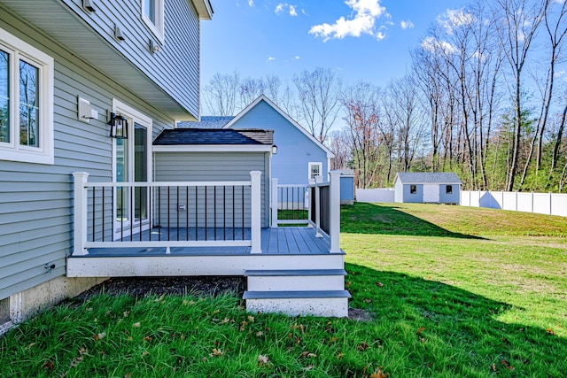 deck with a yard and a storage unit