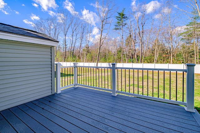 wooden deck with a lawn