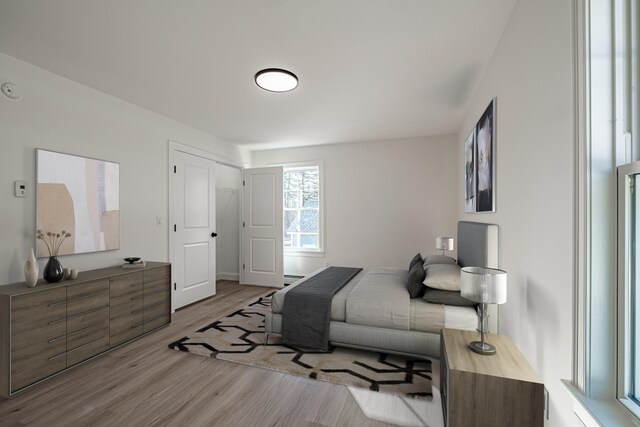 bedroom with light hardwood / wood-style flooring