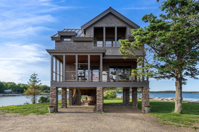 view of front of house with a water view