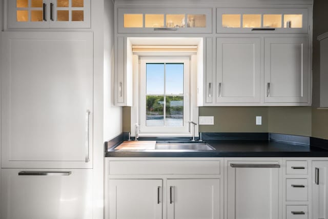 kitchen with sink and white cabinets