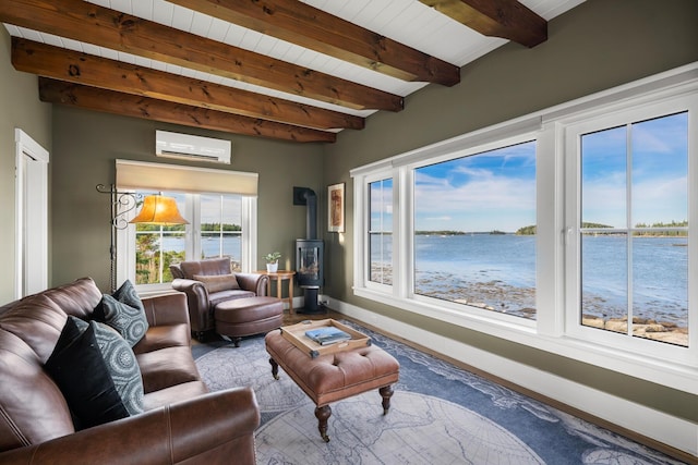 living room featuring a wall mounted AC, a wood stove, beamed ceiling, and a water view