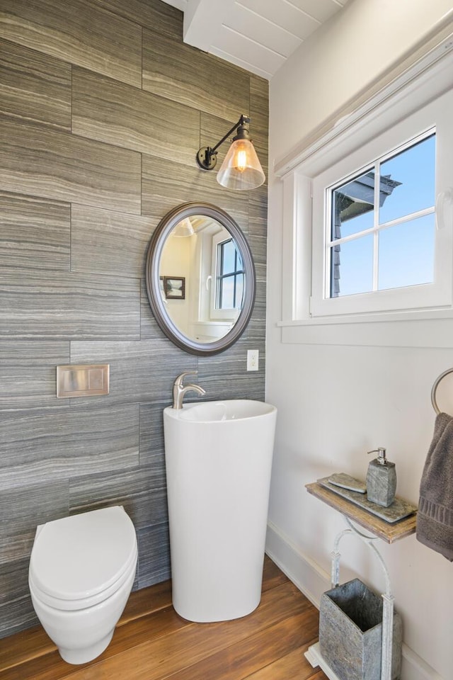 bathroom featuring hardwood / wood-style floors and toilet