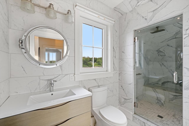 bathroom featuring toilet, an enclosed shower, vanity, and tile walls