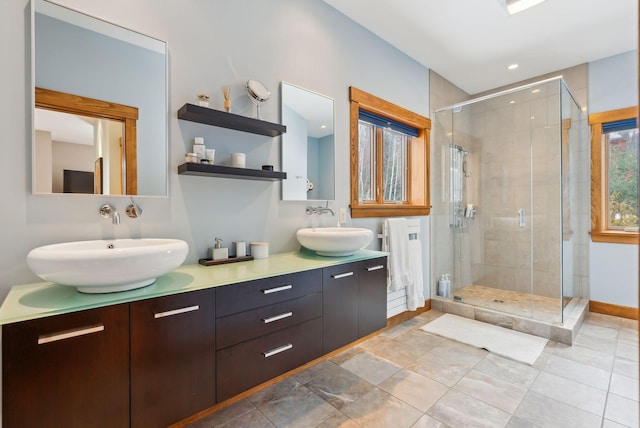 bathroom with walk in shower and vanity