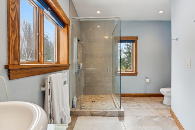 bathroom with toilet, a shower with door, and tile patterned flooring