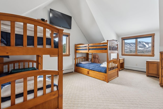 carpeted bedroom featuring a baseboard radiator and vaulted ceiling