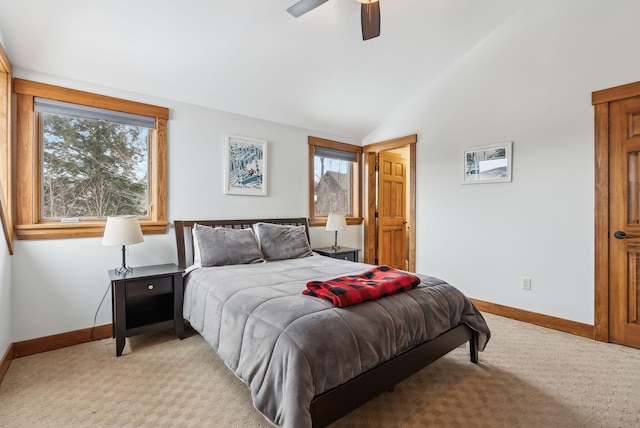 bedroom with ceiling fan, light carpet, multiple windows, and lofted ceiling