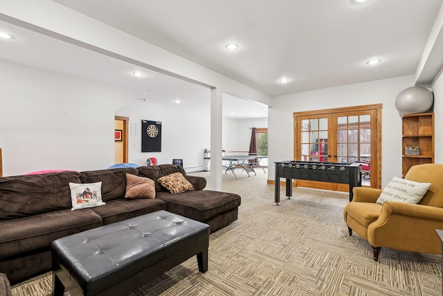 carpeted living room featuring french doors