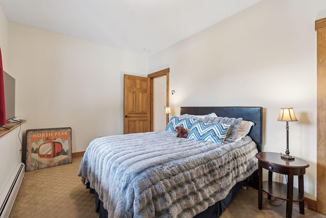 carpeted bedroom with a baseboard radiator