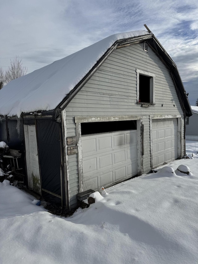 view of snow covered garage