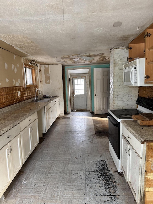 kitchen featuring electric range and sink