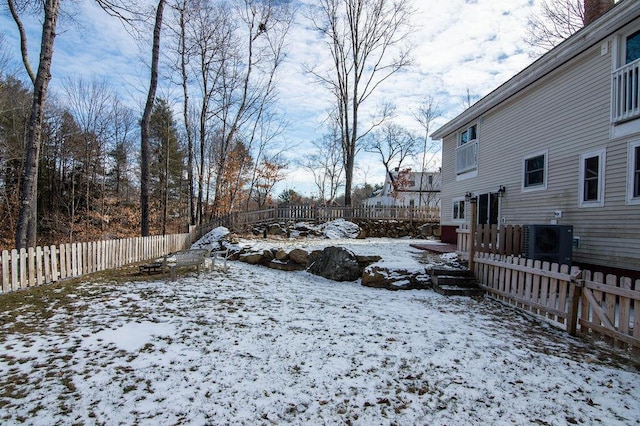 view of yard layered in snow