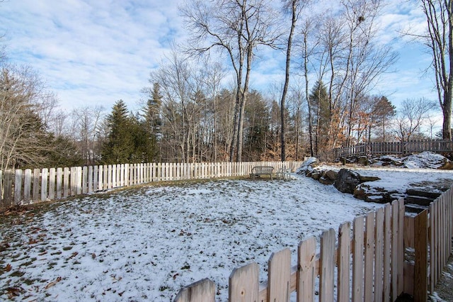 view of yard layered in snow