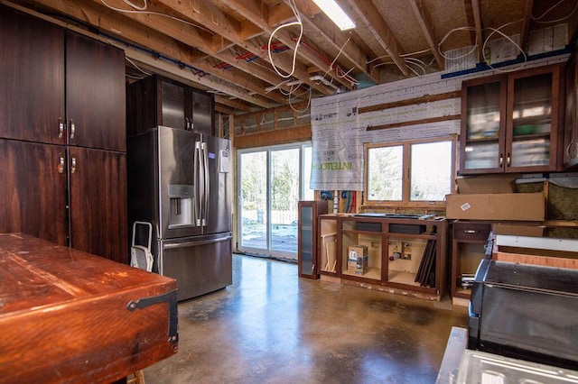 kitchen featuring stainless steel fridge with ice dispenser and dark brown cabinets