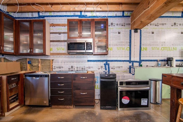 kitchen featuring concrete floors and stainless steel appliances