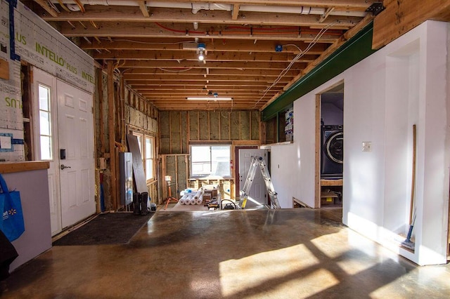 misc room with washer / dryer and concrete floors