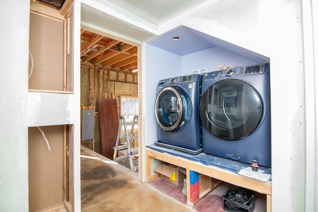 washroom with electric panel and independent washer and dryer