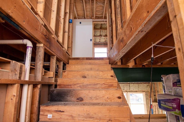 stairway featuring a high ceiling