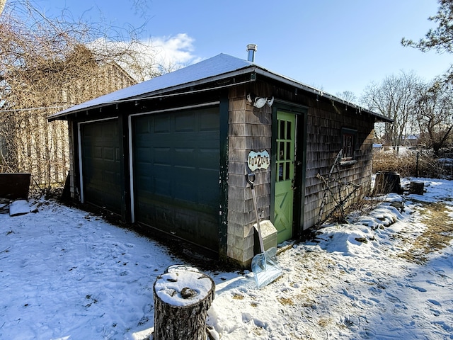 view of snow covered garage