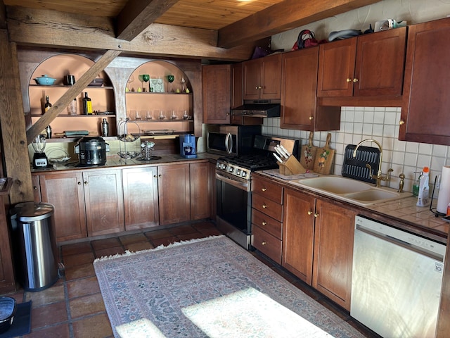 kitchen with wood ceiling, stainless steel appliances, decorative backsplash, sink, and beam ceiling