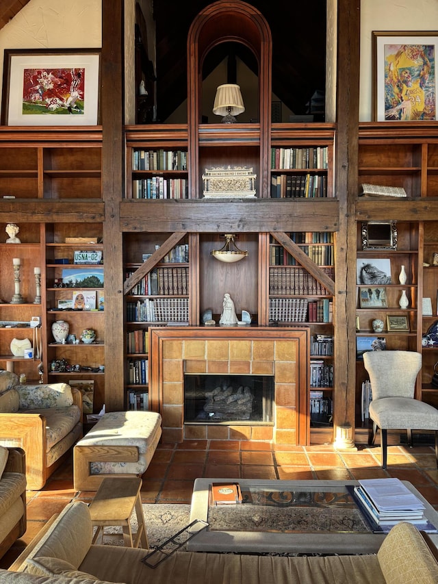 living room featuring a tile fireplace