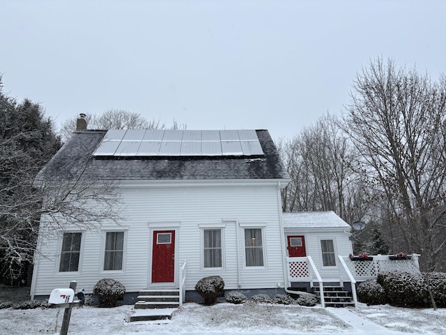 view of front facade with solar panels