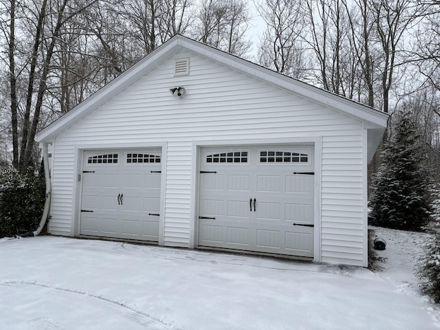 view of snow covered garage