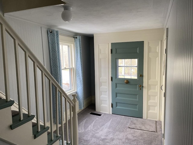 entryway with carpet flooring