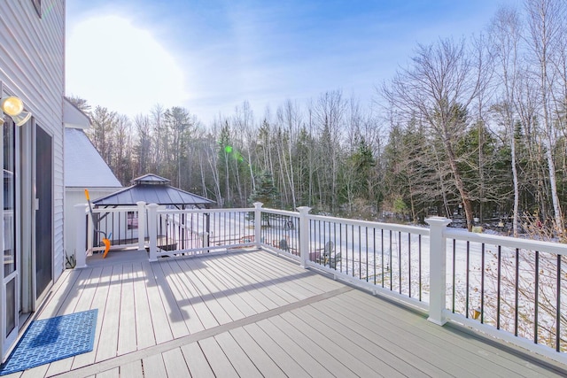 wooden terrace featuring a gazebo