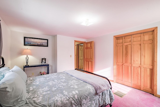 bedroom with a closet and carpet