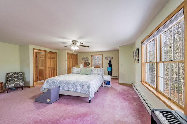 bedroom featuring ceiling fan, baseboard heating, and carpet floors