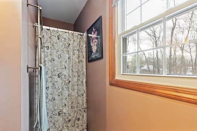 bathroom with a shower with curtain