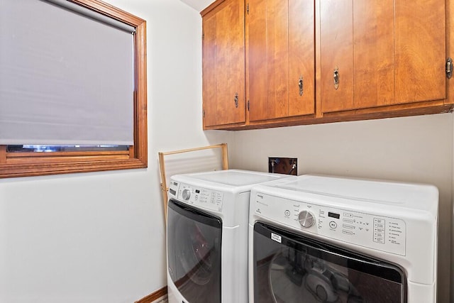 laundry room with cabinets and independent washer and dryer